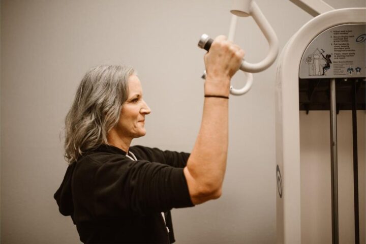 Woman over 50 doing strength training to prevent sarcopenia and muscle loss