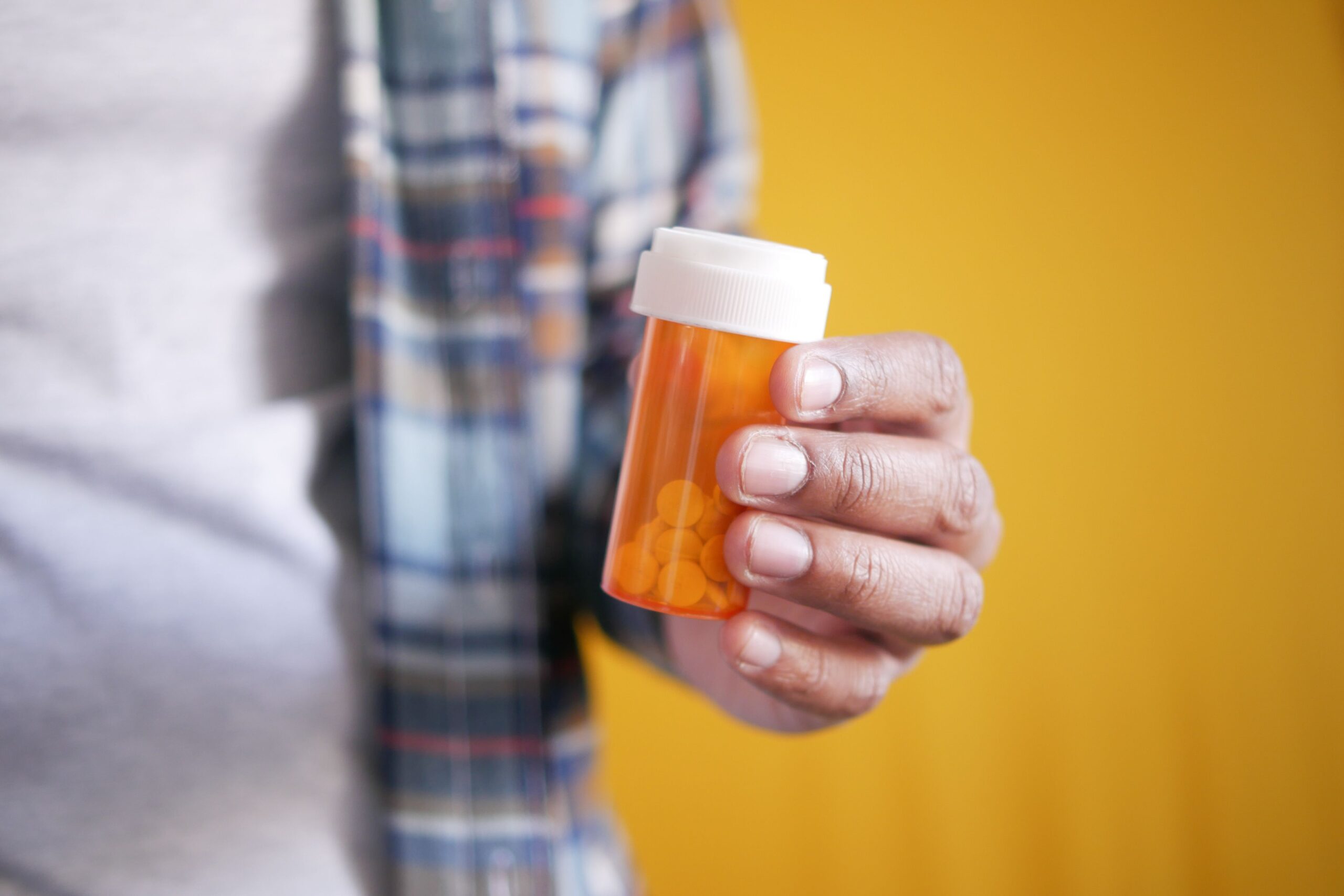 Prescription medication bottle, representing common drug classes with documented weight-gain side effects