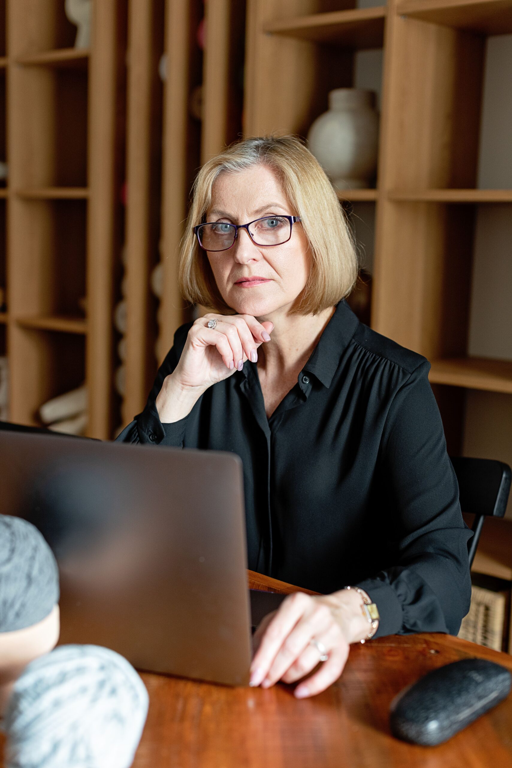 Woman working at a desk, reflecting how daily activity quietly declines with age